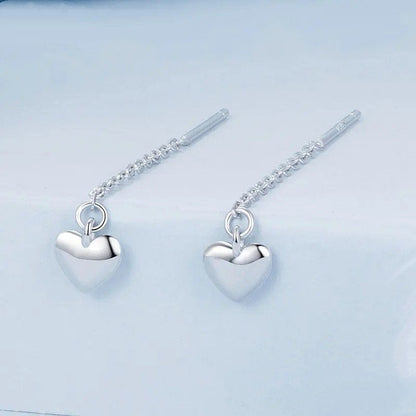 Boucles d'oreilles pendantes en forme de cœur simples avec longs glands